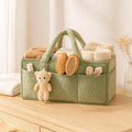 Panier à Langer Teddy Vert Sauge sur une commode de chambre de bébé | BebeSac